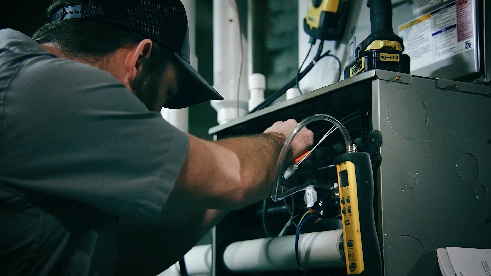 bryant technician working on furnace